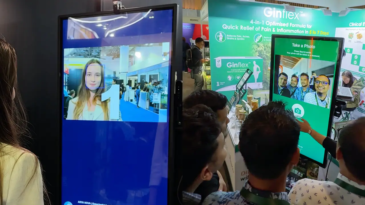 Guests taking a photo at a Searix AI photo booth touchscreen